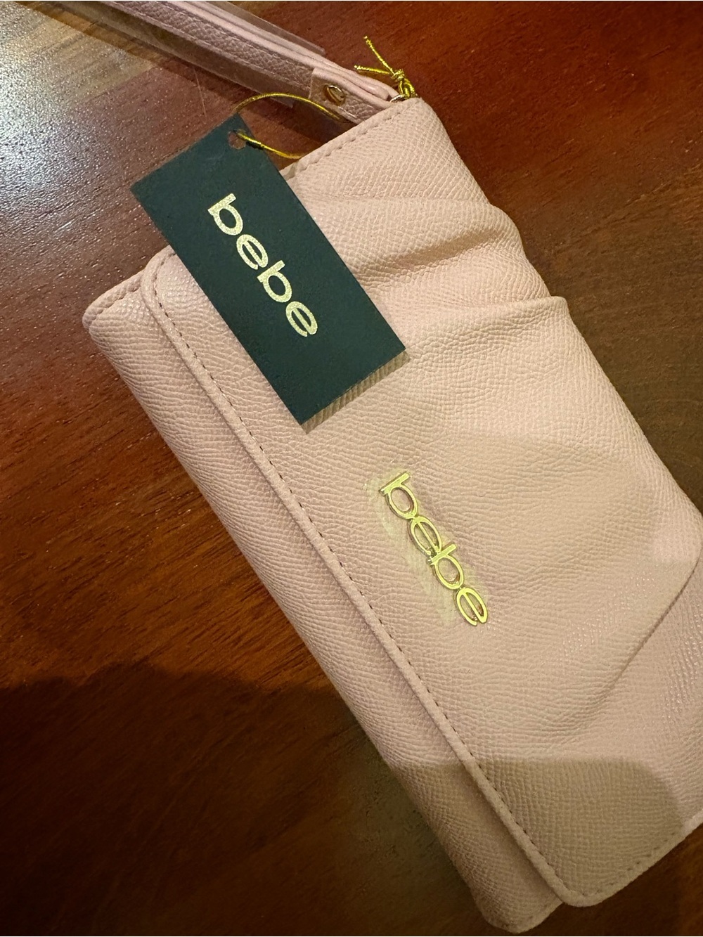 bebe Pale Pink Wristlet Clutch with Gold Logo
